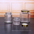 Wholesale cheap empty hexagonal glass honey jam jar with metal lid